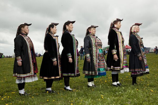 Mari people in the Ural region wearing traditional costumnes