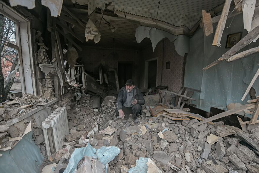 A man in a destroyed house