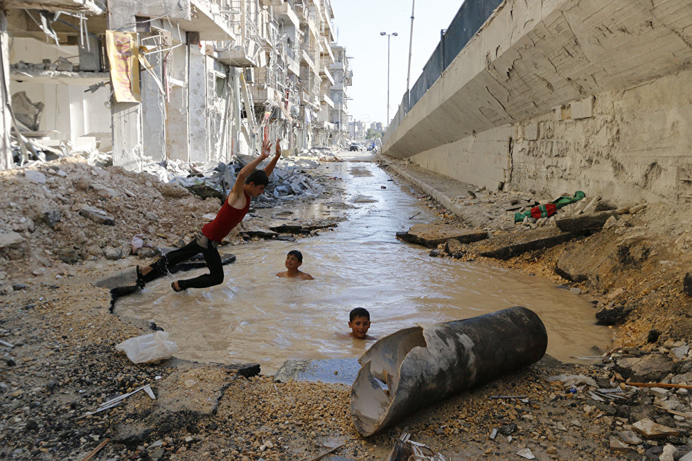Pool in street, Hosam Katan, Syria