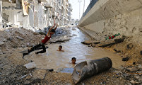 Pool in street, Hosam Katan, Syria