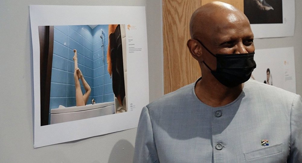 A visitor looks at photos during the opening ceremony of the Stenin Photo Contest exhibition in Pretoria, South Africa. A visitor looks at photos during the opening ceremony of the Stenin Photo Contest exhibition in Pretoria, South Africa.