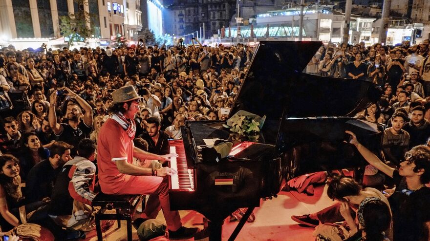 A man plays piano for the protesters in Taksim Square in Istanbul.