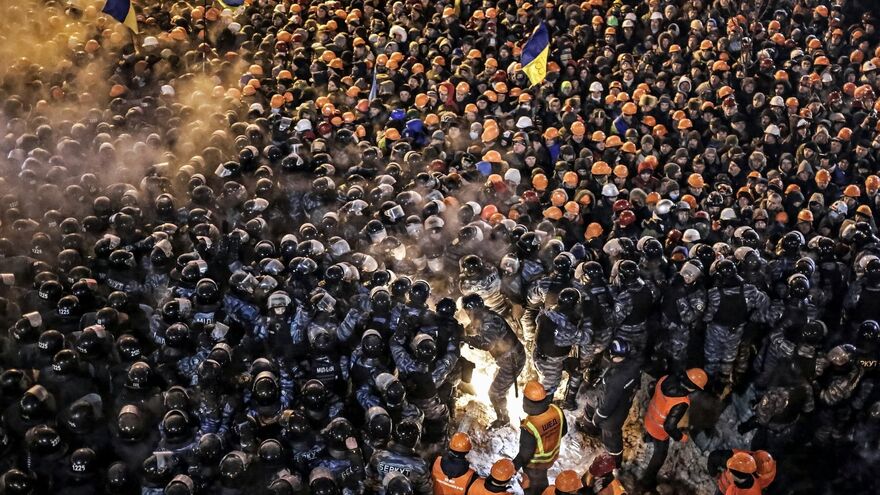 Berkut special foces and housing and utilities staff during a storm of the camp of the supporters of Ukraine's integration with the EU on Maidan Square in Kiev.