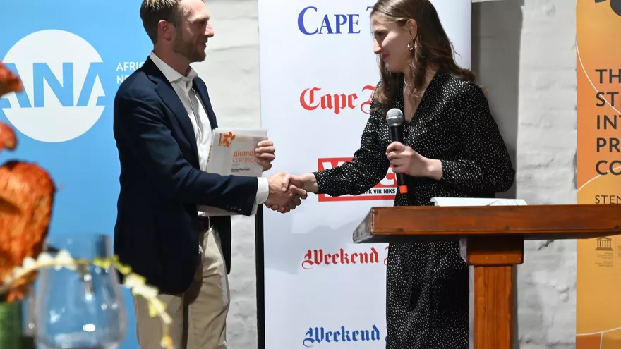 2024 winner from South Africa Gunnar Oberhosel receives his diploma at the opening of Andrei Stenin exhibition in Cape Town